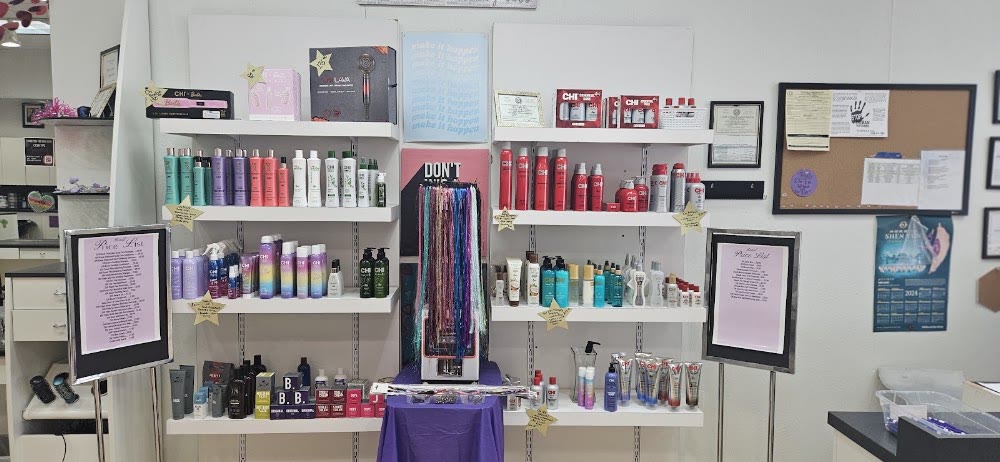 The product wall and price boards inside Brooks City Base Hair Salon